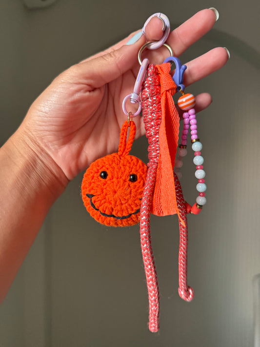 Smiley face bag charm