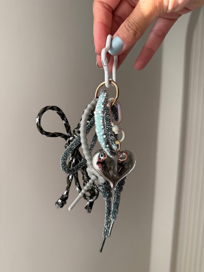 Greyish bag charm